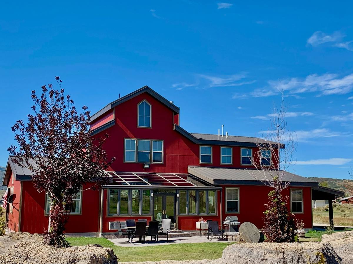 Red barn style home exterior painting Summit County Utah
