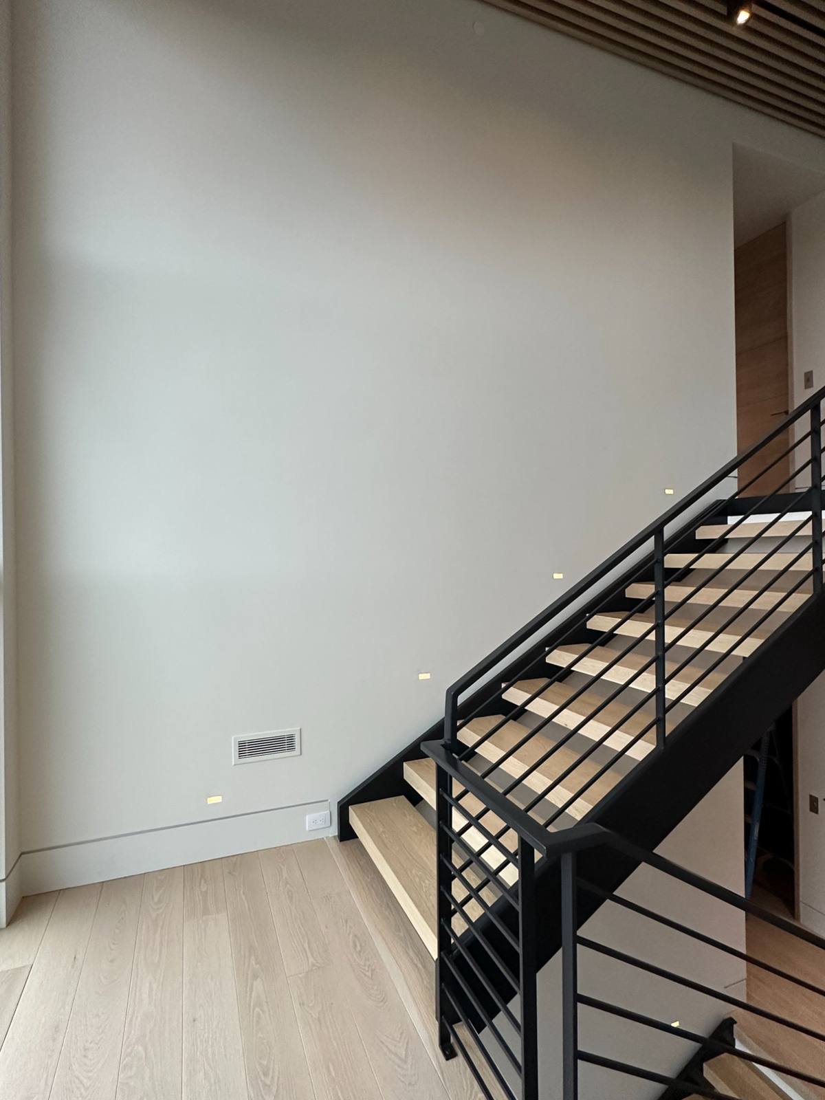 Modern staircase black railing white walls interior Park City