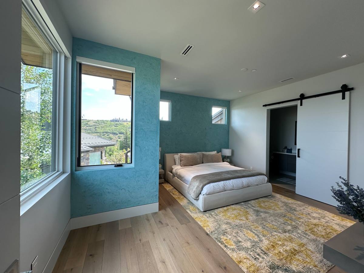 Teal venetian plaster accent wall bedroom Park City Utah